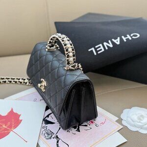 CHANEL Black Quilted Leather Shoulder Bag with Pearl-Trim Handle